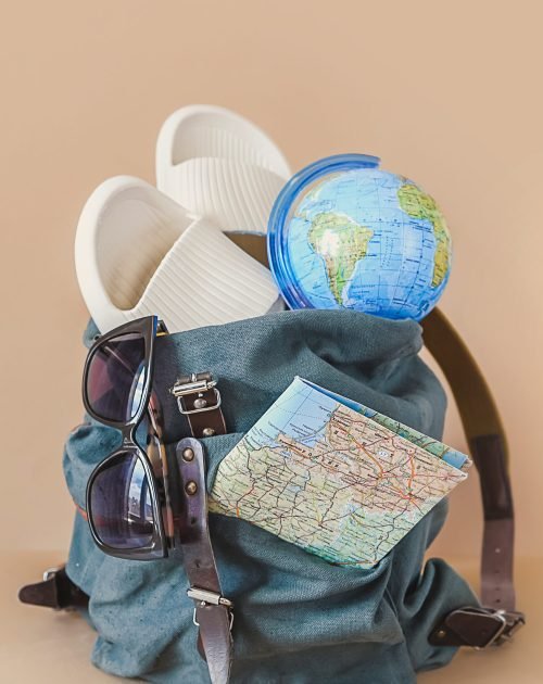 Trips. picking suitcase, things for tourism. Rest in a road trip. Tourism and travel accessories